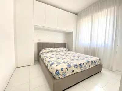 Letto o letti in una camera di Appartamenti Cristina - Carraro Immobiliare - Family Apartments