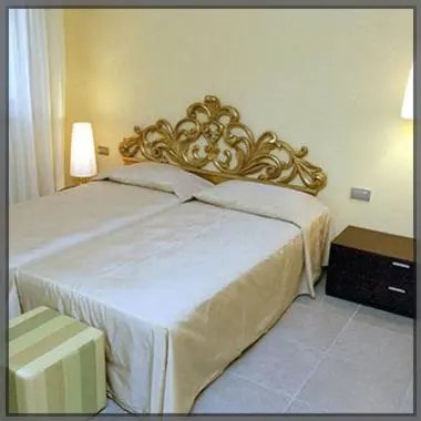 Letto o letti in una camera di Residence La Meridiana