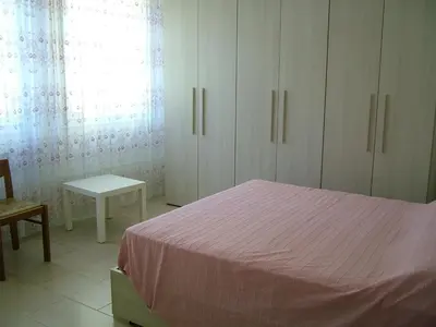 Letto o letti in una camera di San Teodoro Apartment