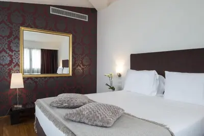 Letto o letti in una camera di Hotel Maggior Consiglio