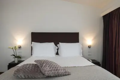 Letto o letti in una camera di Hotel Maggior Consiglio