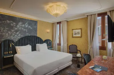 Letto o letti in una camera di NH Venezia Santa Lucia