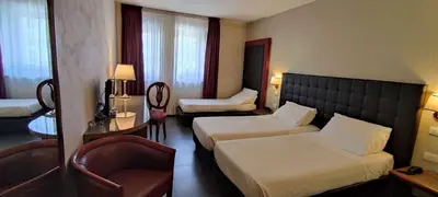 Letto o letti in una camera di Best Western Park Hotel Continental