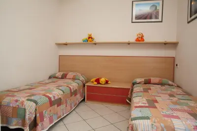 Letto o letti in una camera di Villini Joker ai Frassini
