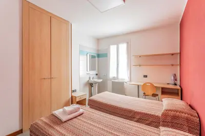 Letto o letti in una camera di Ostello Bassano Del Grappa