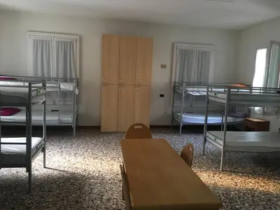 Letto o letti in una camera di Ostello Bassano Del Grappa