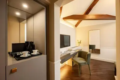 TV o dispositivi per l'intrattenimento presso Hotel Villa Soligo - Small Luxury Hotels of the World