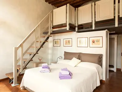 Letto o letti in una camera di WP RELAIS Biennale