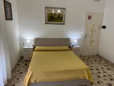 Letto o letti in una camera di Le Maschere