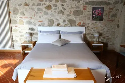 Letto o letti in una camera di I grilli b&b