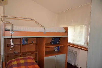 Letto o letti in una camera di Padova Villetta con ampio parco privato