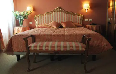 Letto o letti in una camera di Hotel Corte Contarina