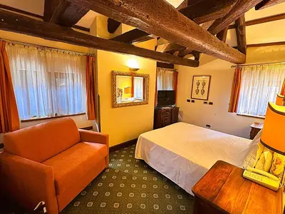 Letto o letti in una camera di Hotel Corte Contarina