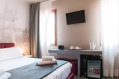 Letto o letti in una camera di Hotel Cannaregio 2357