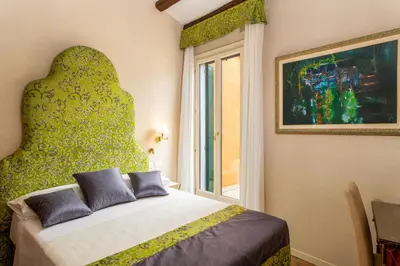 Letto o letti in una camera di Hotel Villa Rosa