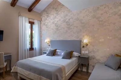 Letto o letti in una camera di Hotel Villa Rosa