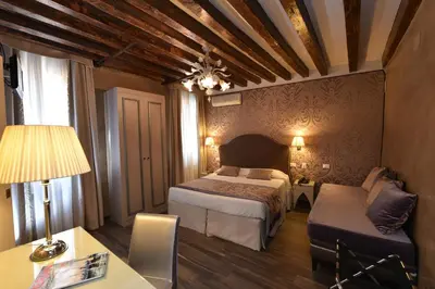 Letto o letti in una camera di Hotel Villa Rosa