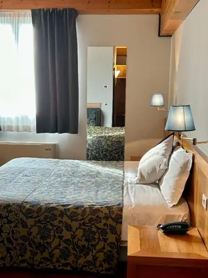 Letto o letti in una camera di Hotel Due Torri Tempesta
