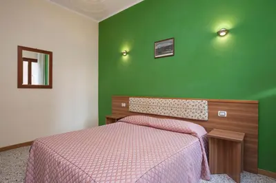 Letto o letti in una camera di Casa Del Melograno