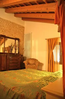 Letto o letti in una camera di LE TRE ARTI B&B