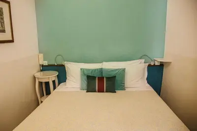 Letto o letti in una camera di Hotel Casa Petrarca