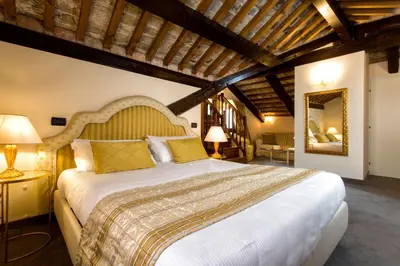 Letto o letti in una camera di Ca' San Giorgio B&B