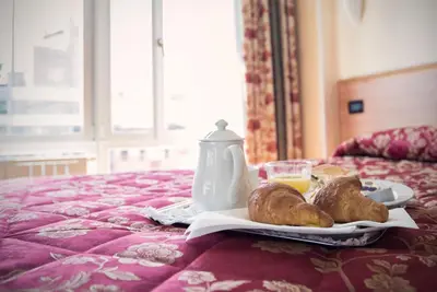 Letto o letti in una camera di Hotel Brennero