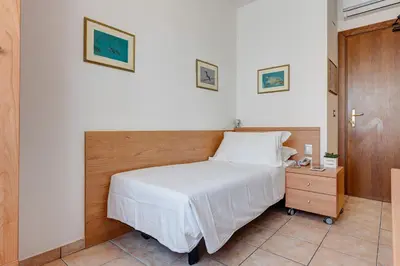 Letto o letti in una camera di Hotel Piccadilly