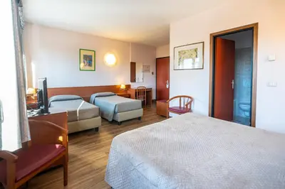 Letto o letti in una camera di Hotel Albatros