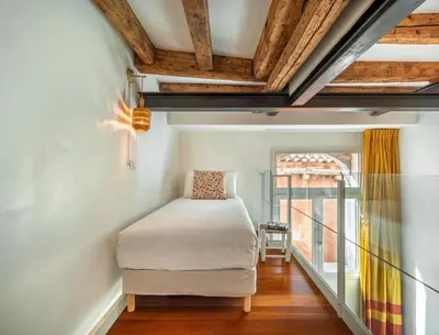Letto o letti in una camera di Zattere Lofts R&R