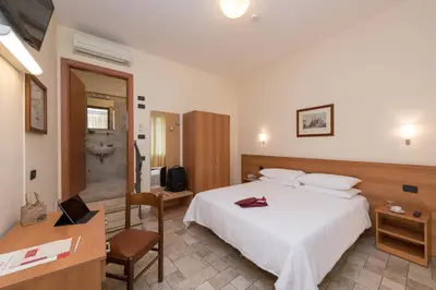 Letto o letti in una camera di Hotel Casa Del Pellegrino