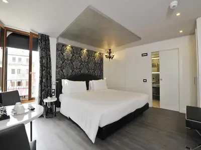 Letto o letti in una camera di Al Theatro Palace