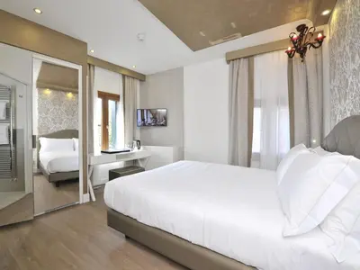 Letto o letti in una camera di Al Theatro Palace