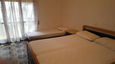 Letto o letti in una camera di ARISTON - WALTERIGATO Apartments SOLO PER FAMIGLIE