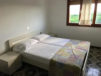 Letto o letti in una camera di ARISTON - WALTERIGATO Apartments SOLO PER FAMIGLIE