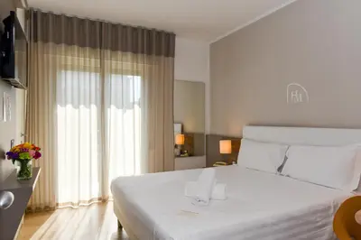 Letto o letti in una camera di Hotel Delle Mimose