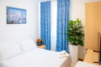 Letto o letti in una camera di Hotel New Aurora Venice