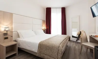 Letto o letti in una camera di Regent's Hotel