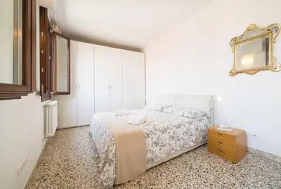Letto o letti in una camera di VeNICe Cera Casa Margherita