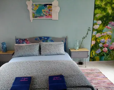 Letto o letti in una camera di Night Galleria holiday home - bed & art in Burano - the pink house