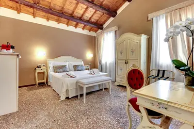 Letto o letti in una camera di Ca' Riza