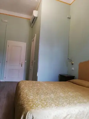 Letto o letti in una camera di Palazzo Lion Morosini - Check in presso Locanda Ai Santi Apostoli