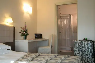 Letto o letti in una camera di Hotel Calinferno