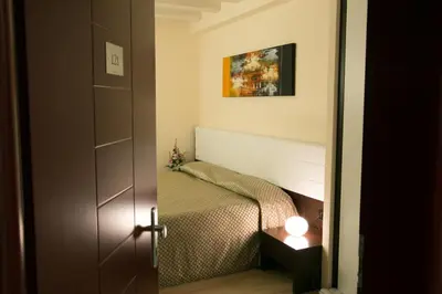 Letto o letti in una camera di Hotel Calinferno
