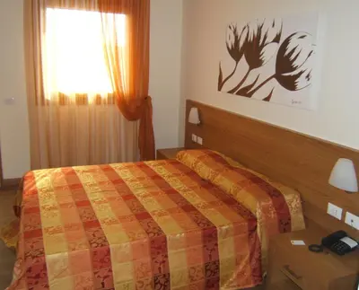 Letto o letti in una camera di Hotel Calinferno