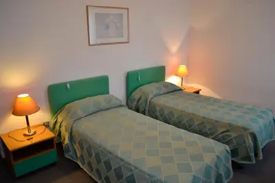 Letto o letti in una camera di Hotel Ezzelino