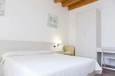 Letto o letti in una camera di Residence Eremitani