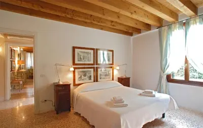 Letto o letti in una camera di Casa Contarini