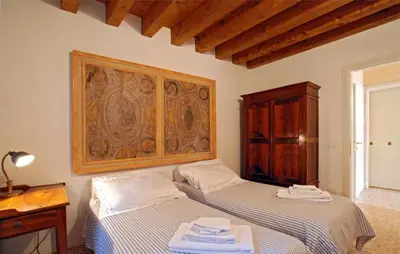 Letto o letti in una camera di Casa Contarini