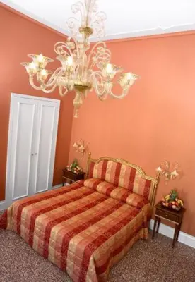Letto o letti in una camera di Ca' Gottardi